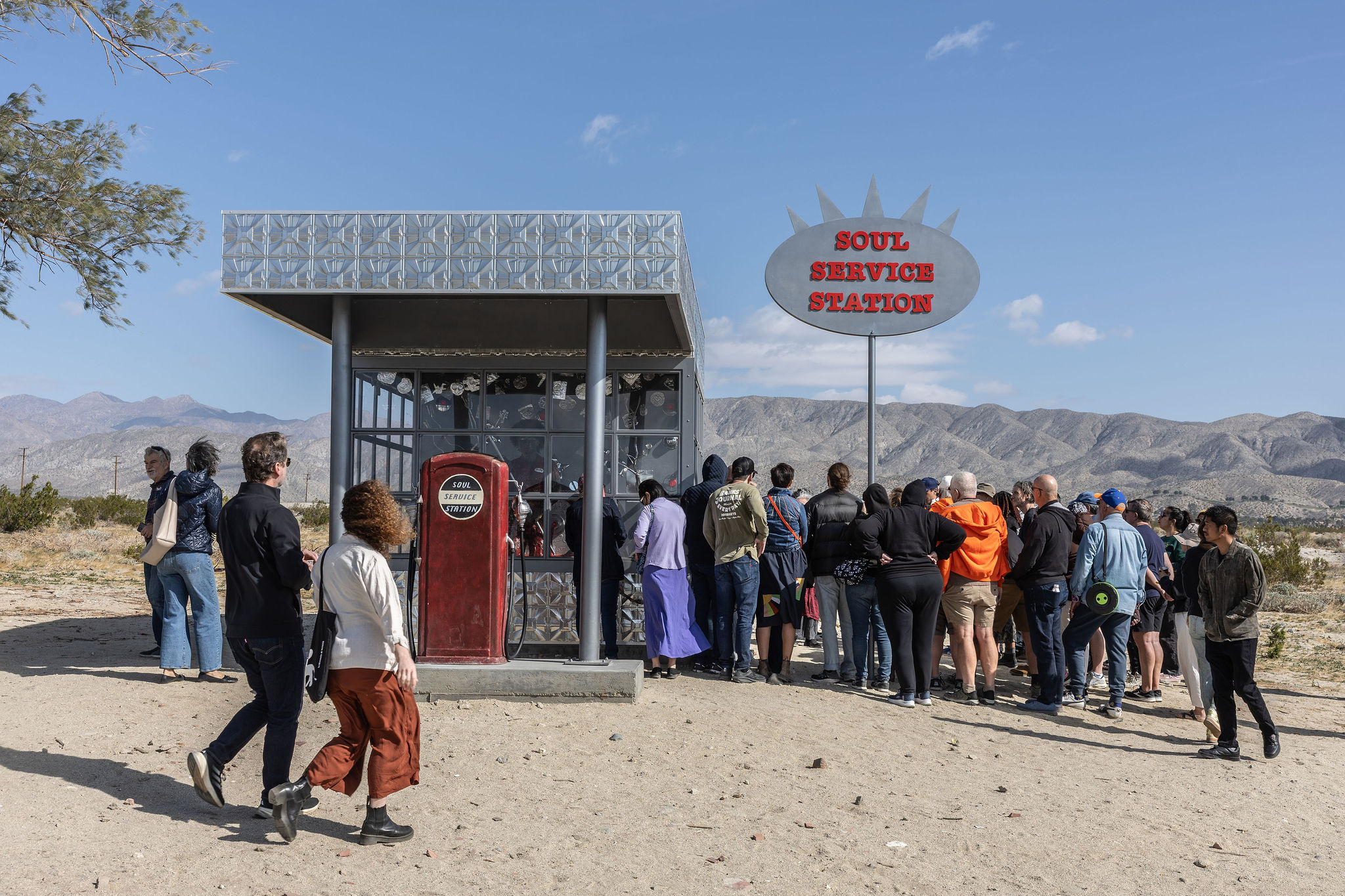 March 30, 2025. Guest arrive at Alison Saar’s “Soul Service Station” during a Desert X “Walk & Talk” public program. Photo by Katie Jones.