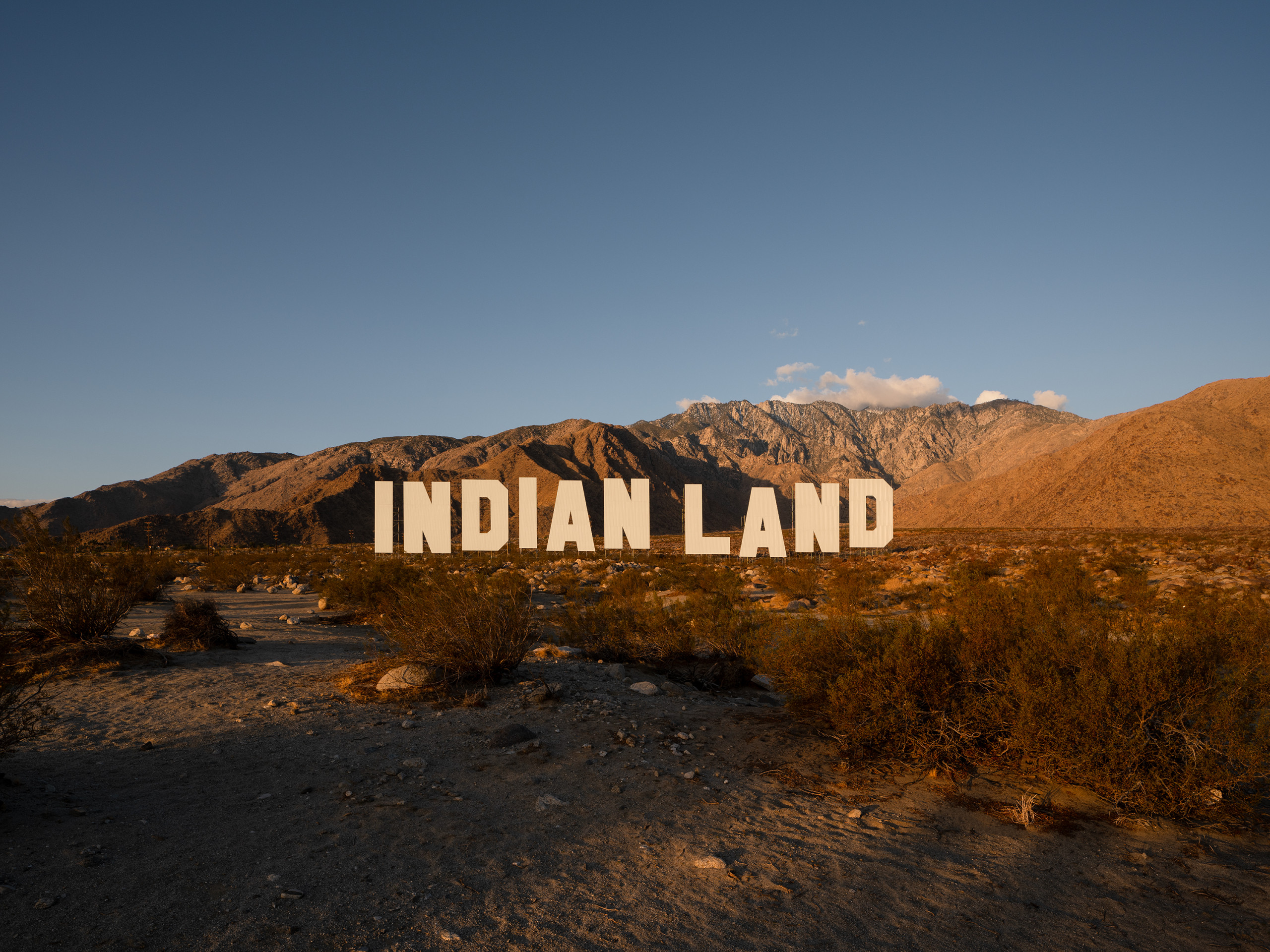 Nicholas Galanin, *Never Forget*, Desert X 2021. (link: https://www.gofundme.com/f/landback text: Donate to the LANDBACK GoFundMe)